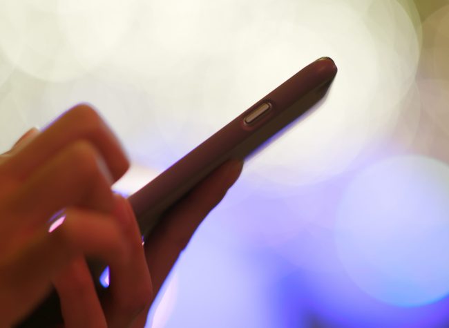 Person using iPhone searching Yorkville Digital Marketing